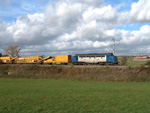  V 170 1125 am 25.10.2004 mit dem Schotterreinigungszug, in der Gegend von Alzingen bei der Arbeit
